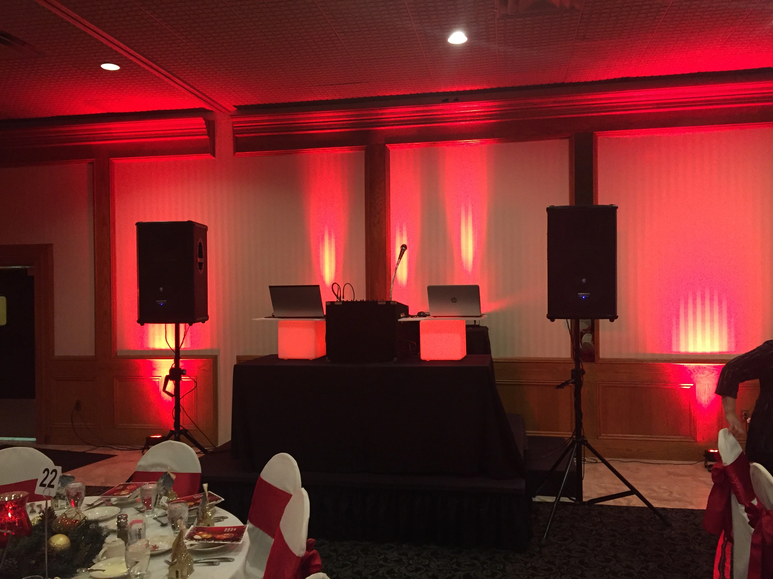 DJ setup with red uplighting for a Detroit event