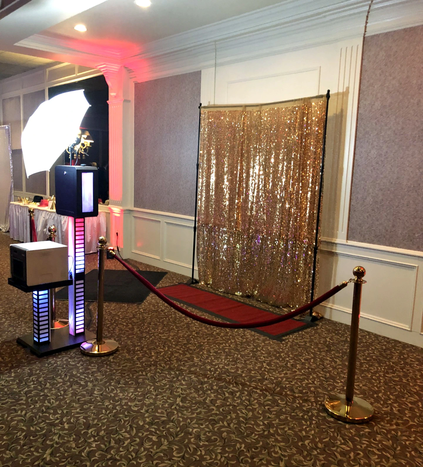 Detroit photo booth rental setup with gold backdrop and red carpet